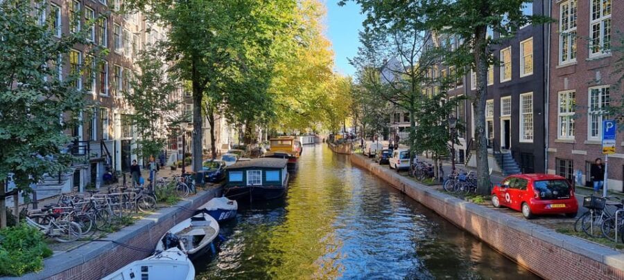 Amsterdam All In One Tour Walking Tour - Beyond postcards: Red windows, drugs, and the stories people avoid