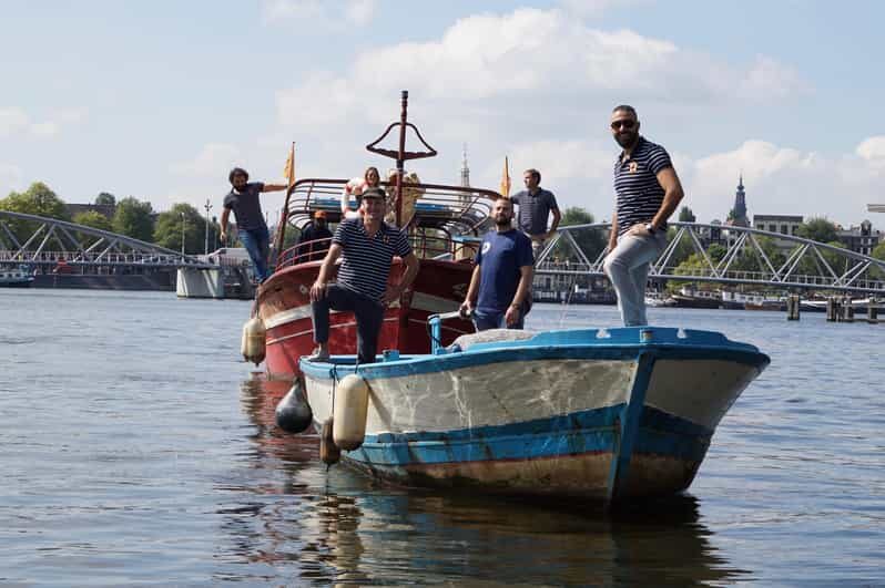 Amsterdam: Canal Cruise on a Wooden Refugee Boat - Key highlights you’ll feel during the cruise