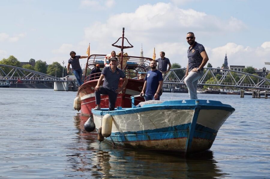 Amsterdam: Canal Cruise on a Wooden Refugee Boat - Guides and captains: refugee storytellers with space for your questions