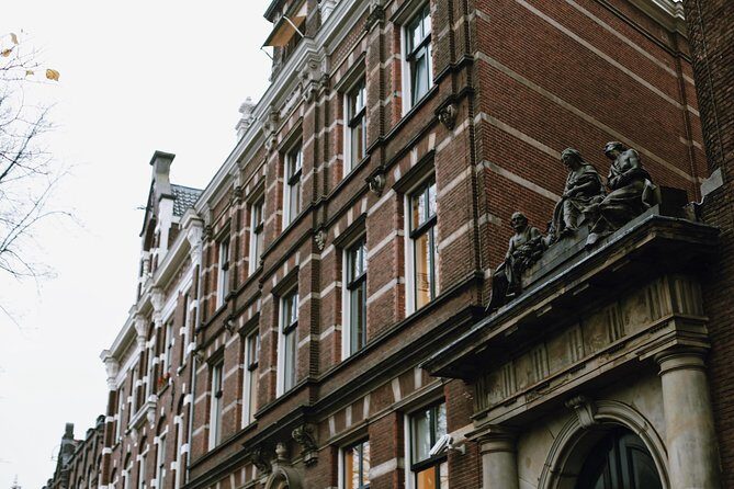 Amsterdam City Center Guided Walking Tour Semi-Private 12ppl Max - Canal-Corner Details: Huis aan de Drie Grachten and the Begijnhof Courtyard Still Feel Private