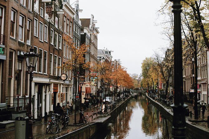 Amsterdam City Center Guided Walking Tour Semi-Private 12ppl Max - Your First Two Hours: Start at St. Nicholas Basilica, Then Read the City Like a Map