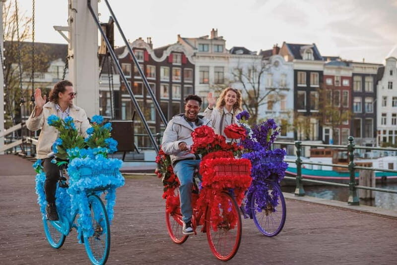 Amsterdam: Explore Canals, Guided Tour on Flower Bikes - Getting Started at Nieuwezijds Voorburgwal: Central, Simple, and Quick
