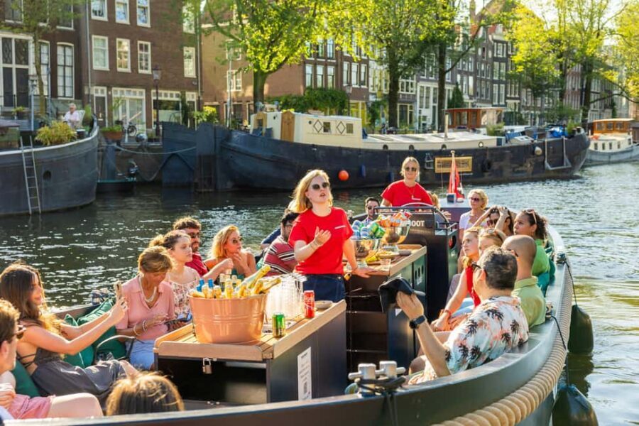 Amsterdam: Guided Open Boat Canal Cruise Including Drink - Guide style: live commentary that actually helps you see