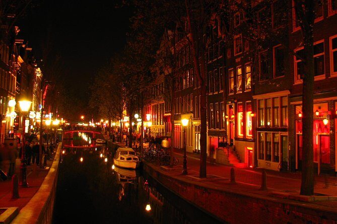 Amsterdam: Guided Red Light District and City Walking Tour - The Dam and Amsterdam’s Wooden-Pole Foundations