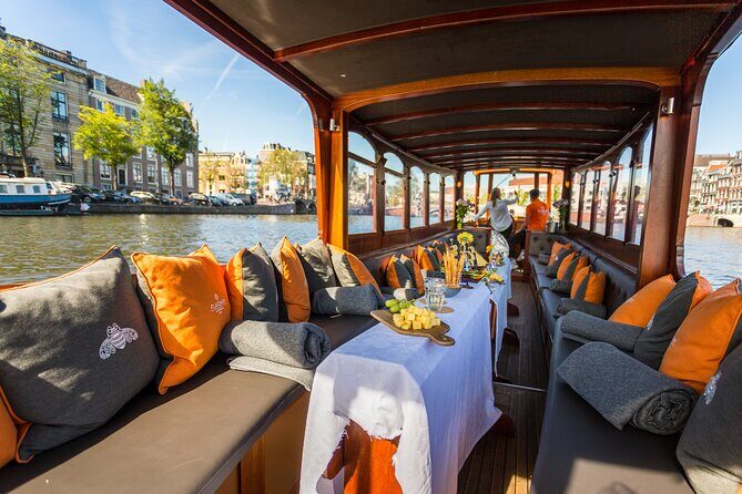 Amsterdam Historic Tour On Classic Saloon Boat - Weather Plans: Covered Boats and Free Ticket Changes