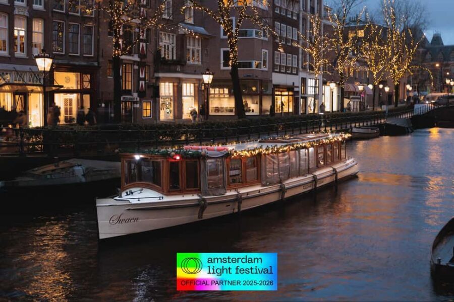 Amsterdam: Light Festival Heated Cruise with Drinks Option - Photo strategy on a covered canal cruise