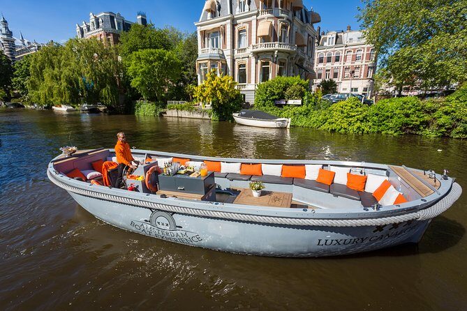 Amsterdam Private Boat Trip With Skipper, Burger and Beers - Amstel bridges, the floating flower market, and NEMO’s green ship