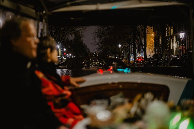 Amsterdam: Private Romantic Evening Canal Cruise + Bubbles/Snacks - The night route: quiet canals, love stories, and bridge-light theatre