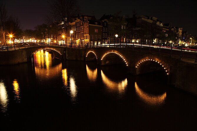 Amsterdam: Private Romantic Evening Canal Cruise + Bubbles/Snacks - Skinny Bridge in the lights: hundreds of points that sparkle