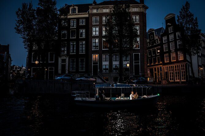 Amsterdam: Private Romantic Evening Canal Cruise + Bubbles/Snacks - Torensluis Bridge (1648) and the smallest house fact you can’t ignore