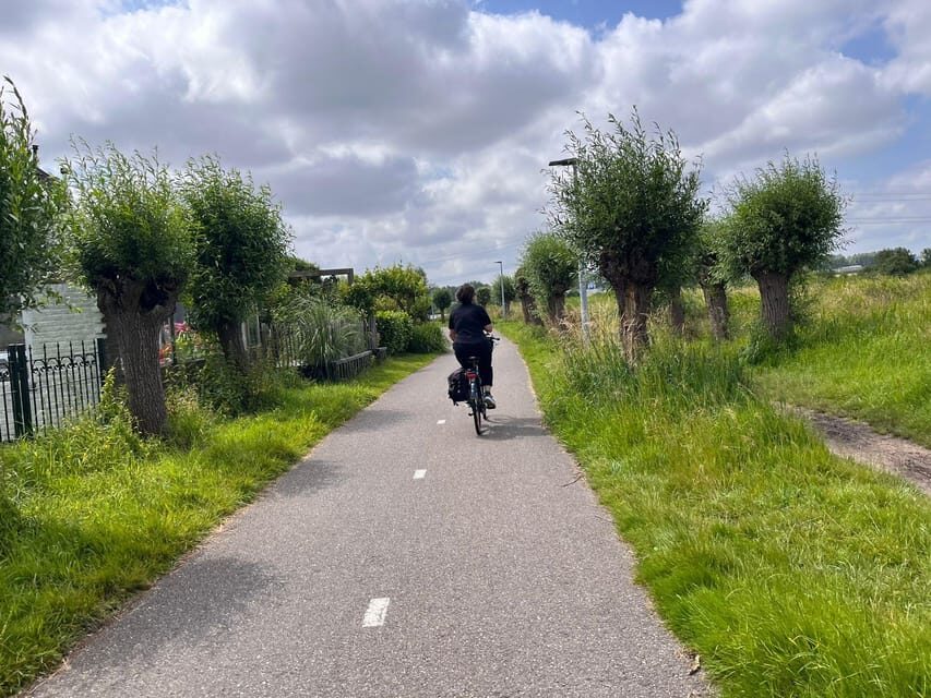 Amsterdam: Rainbow Rural Bike Tour With Local Gay Guide - Windmill and waterworks: the Dutch trick of living with water