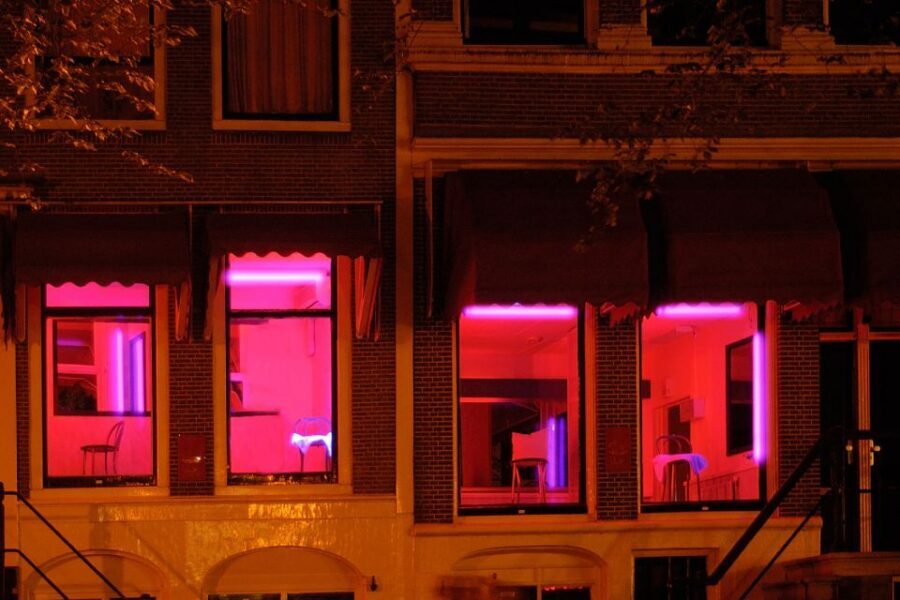 Amsterdam: Red Light District 1-hour Smartphone Audio Tour - Hidden corners: sailors, merchants, and Café In’t Aepjen