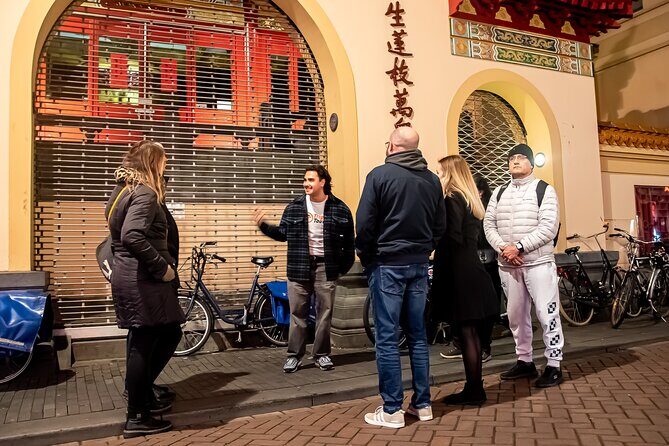Amsterdam Red Light District and City Center Walking Tour - Stop 1: De Wallen at night and the real stories behind the windows
