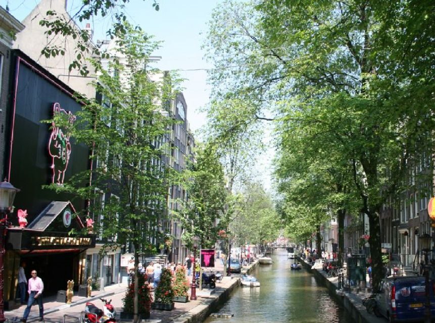 Amsterdam: Red Light District and Coffeeshop tour - What you’ll see: red windows, canals, and the oldest-building feel