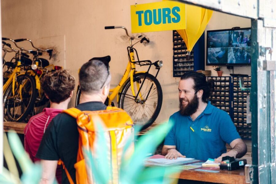 Amsterdam: Relaxed City Highlights Guided Bike Tour - Getting to Nieuwezijds Kolk and Yellow Bike Tours near Central Station