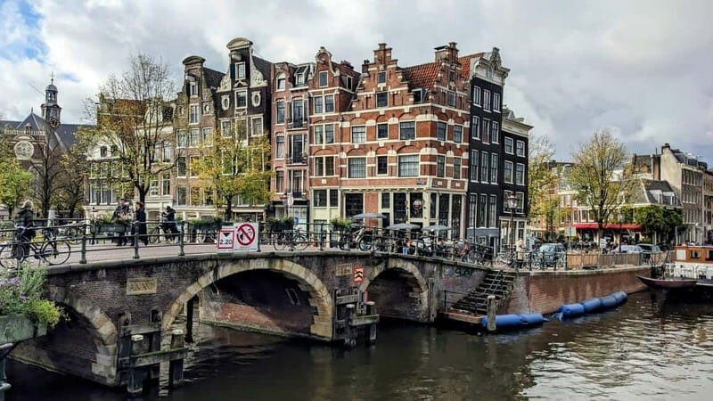 Amsterdam: Rembrandt & Van Gogh walking tour - Nieuwmarkt Square and Het Trippenhuis: Where Amsterdam’s Layers Show Up