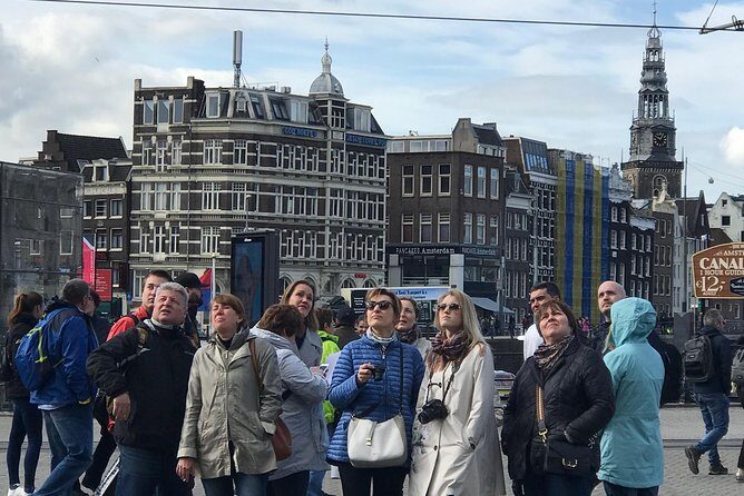 Amsterdam Sightseeing Tour + Hidden Gems + Tastings + PDF guide - Bloemenmarkt and Munttoren: Floating Flowers With Financial and Social Clues