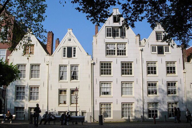 Amsterdam Sightseeing Tour + Hidden Gems + Tastings + PDF guide - Damrak: Cheese and Stroopwafels Taste Better After You Hear the Why