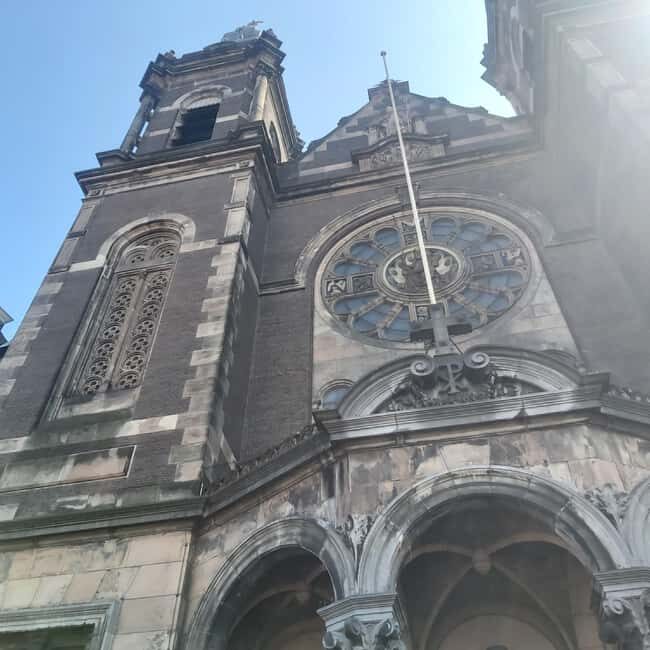 Amsterdam: Spanish Tour Unmasking the Redlight District - Hidden stop and “small places” that carry big meaning