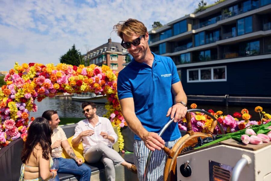 Amsterdam: The Original Flower Boat with Local Guide and Bar - The route: Oudeschans, Herengracht, and the stops made for pictures