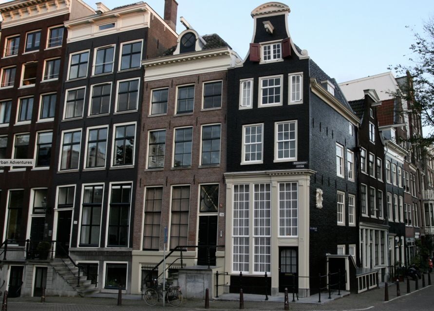 Amsterdam: The Story of History & Culture Walking Tour - Historic Buildings and Canals: Learning by Seeing, Not Reading