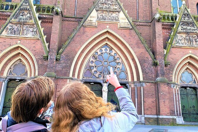 Discover Amsterdam's city center in this Outside Escape game tour - Munttoren at a lively square: Tower of Coins vibes