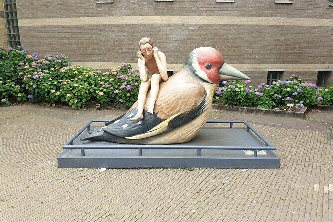 Discover the best spots in Den Bosch with Outside Escape - Rozemarijnstraatje: a small alley with a wall-story background