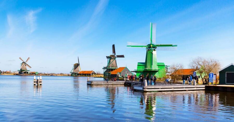 From Amsterdam: 4 Provinces Highlights Van Tour - Zaanse Schans windmills: morning light, river views, and the best photo angle