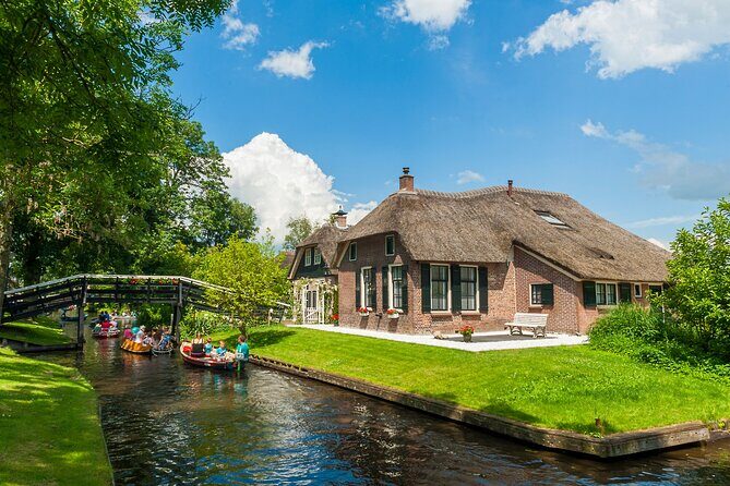 Giethoorn Day Trip from Amsterdam With Cruise and Cheeseplatter - Optional Amsterdam canal cruise voucher: upgrade your day with a flexible return to the water