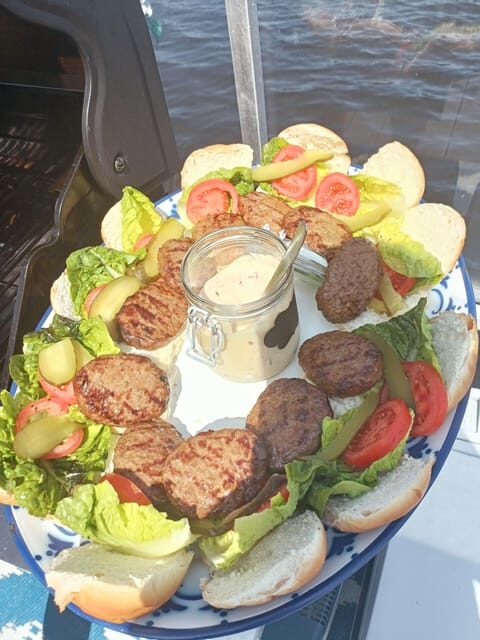 Groningen: Private Highlights BBQ with Drinks on the Lake - The roofed terrace and BBQ setup: comfort with real food