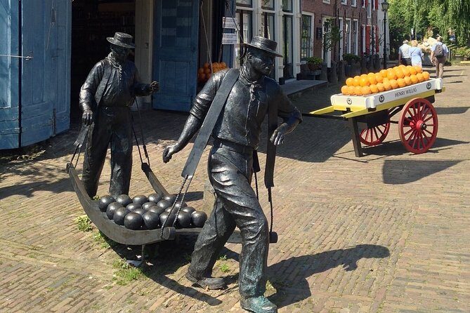 Half-Day Edam and Volendam Private Walking Tour from Amsterdam - The family smokehouse lunch idea: eel soup in a champagne glass