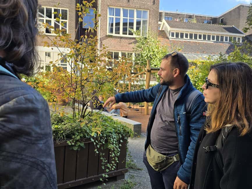 Liberal Amsterdam: Small-Group Walking Tour & Anne Frank VR - Aluminium Bridge and Staalmeestersbrug: leaning houses, canal life, and the water lesson