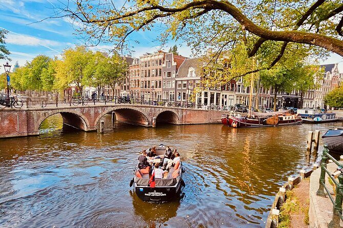Private 90 Minute Amsterdam Canal Belt Exploration Cruise - Amstel River opening: dancing houses and the city’s curve from the water