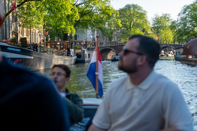 Private Boat Tour Amsterdam - 90 Min incl. welcome drink on historic saloon boat - What Happens During the 90 Minutes on the Canals