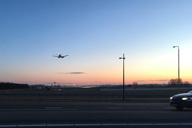 Private departure transfer from Amsterdam to Schiphol Airport (AMS) - Door-to-Door Pickup: From Hotel Steps to Cruise Ship Arrival