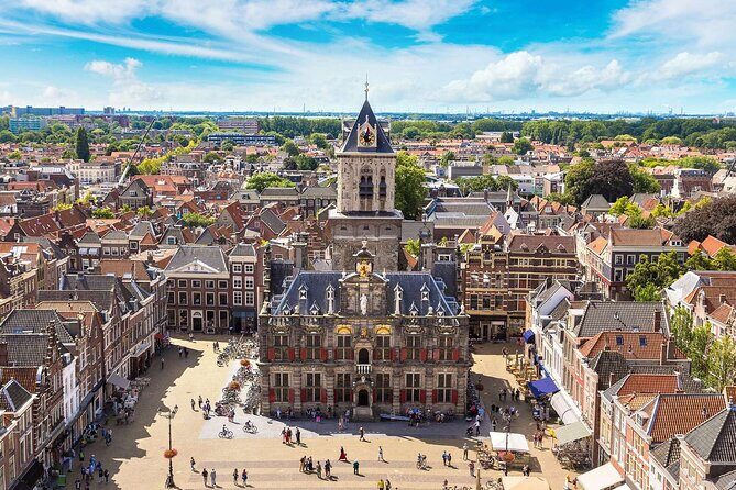 Private tour to Kinderdijk windmills and Delft from Amsterdam - Delft with canals and choices: churches, Vermeer, and lunch around the square